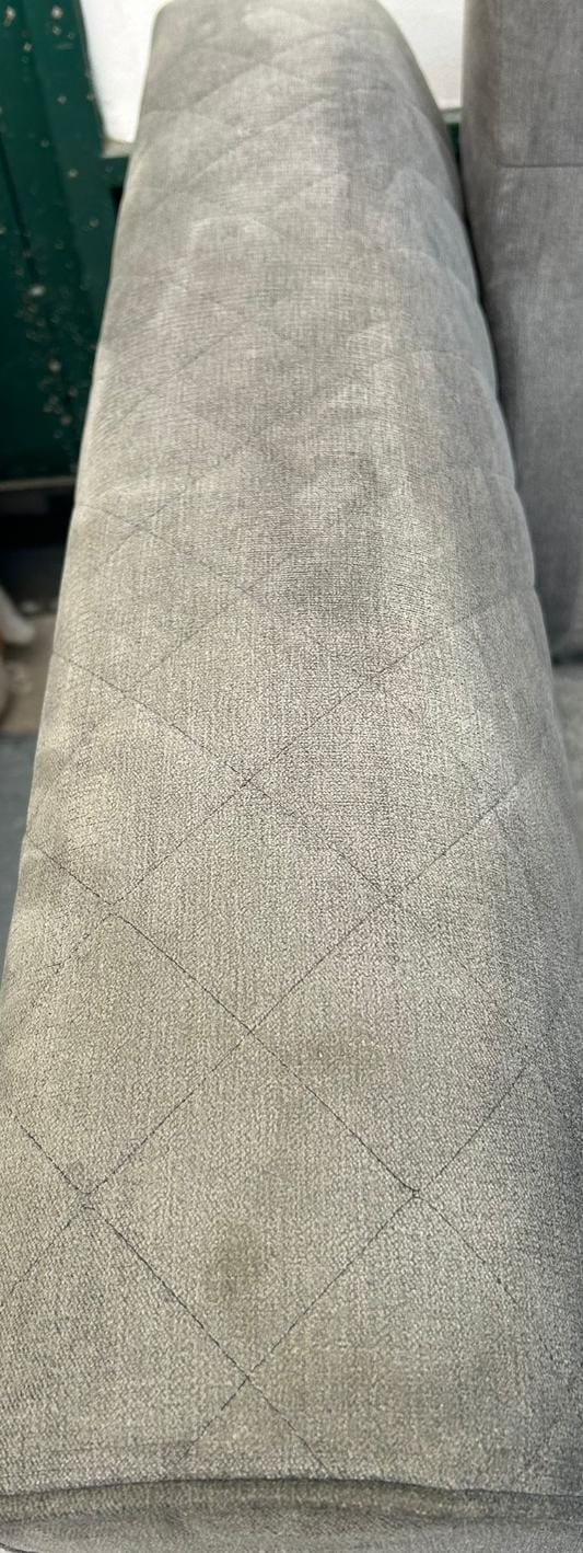 Grey DFS Orka corner sofa with matching storage footstool