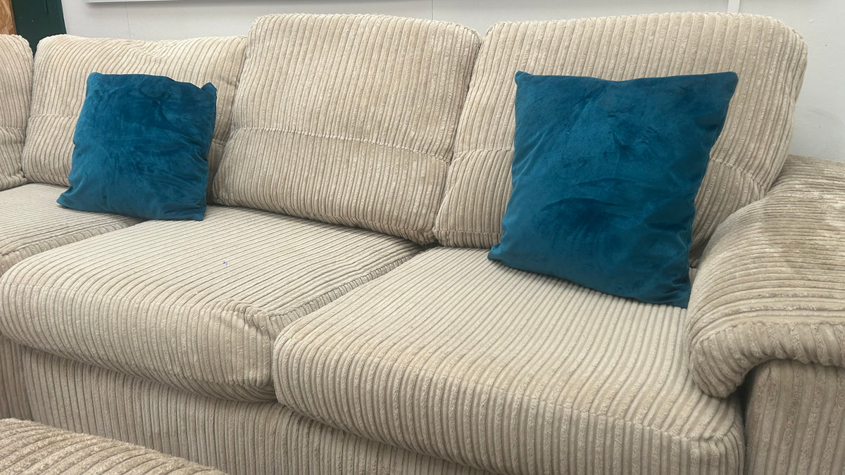Beige cord DFS corner sofa bed with matching footstool